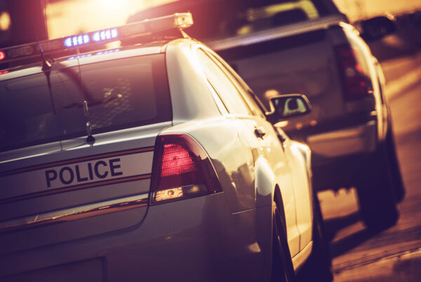 police car pulling over a driver suspected of DWI