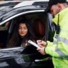 police officer pulling over suspected DWI driver